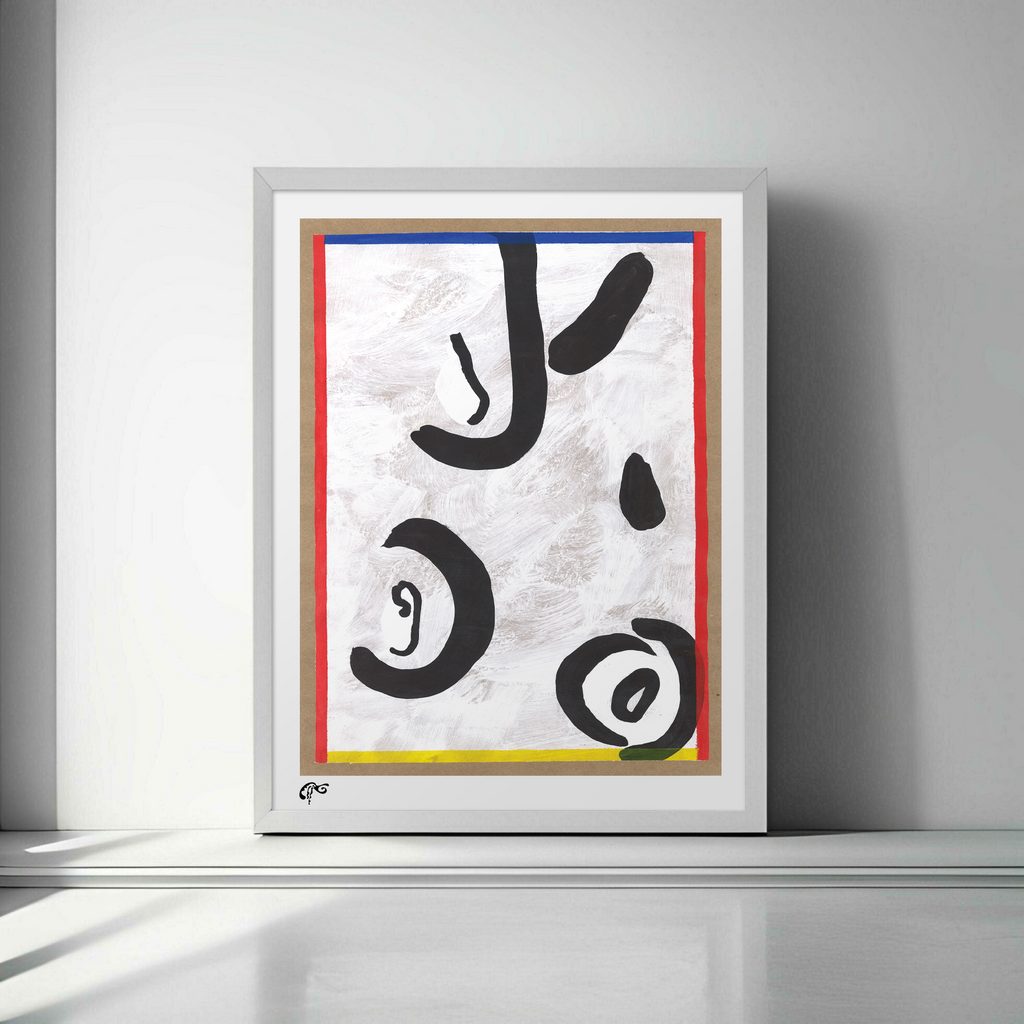Framed abstract artwork with black, red, yellow, and blue on a white wall.